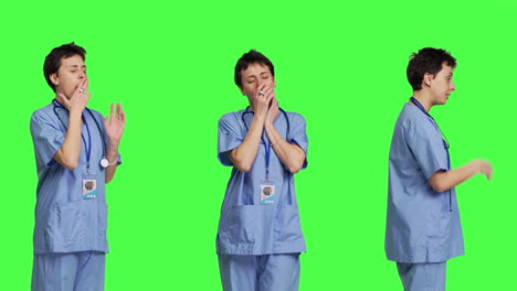 Medical-assistant-feeling-extremely-sleepy-against-greenscreen-backdrop